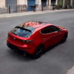 2026 MAZDA3 hatchback driving on street