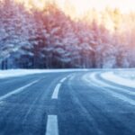 winter road, covered with snow on sunny day