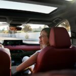 Woman smiling inside Mazda CX-70