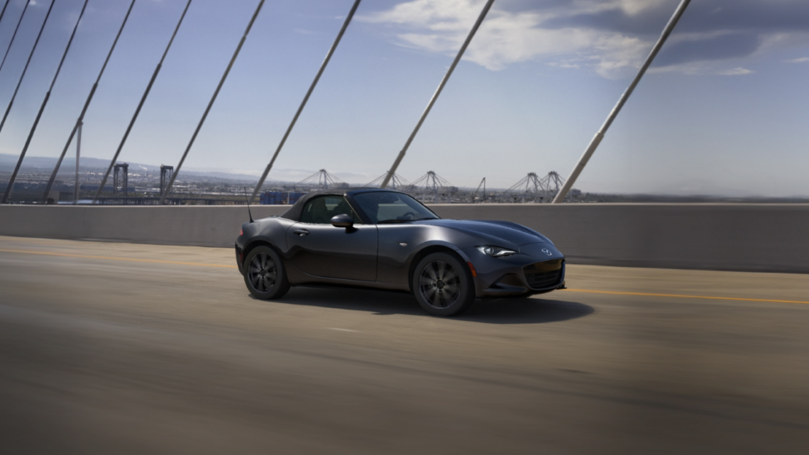 2026 MAZDA MX-5 Miata driving on a bridge