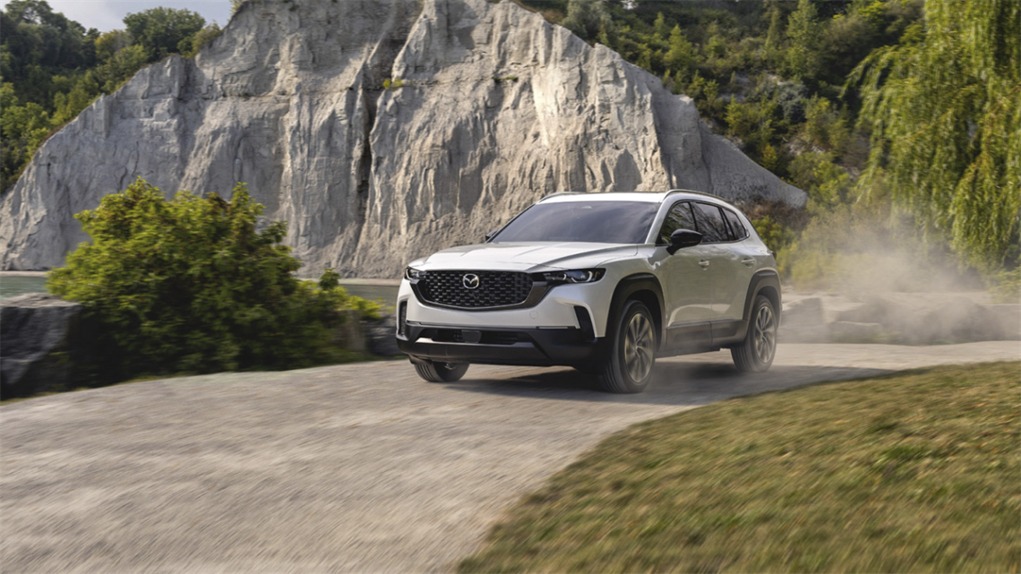 2026 Mazda CX-50 driving on dusty road